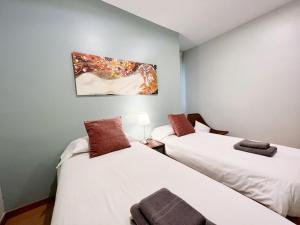 Postel nebo postele na pokoji v ubytování Gracia Village Barcelona
