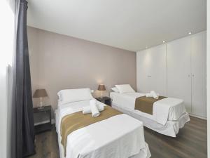 Posteľ alebo postele v izbe v ubytovaní Loft Miro Apart Barcelona