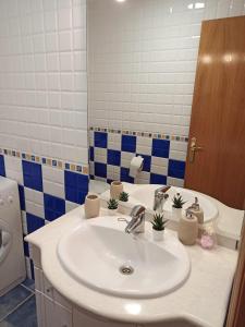 a bathroom with a sink and a mirror at Apartamento Montanejos in Montanejos