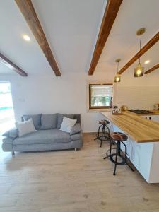 a living room with a couch and a table at Danino in Jezera