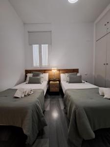 Posteľ alebo postele v izbe v ubytovaní DreamsApt Curtidores 6 Suites AT