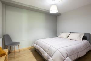 A bed or beds in a room at Bright 2BDR Apartment Downtown Exarcheia!