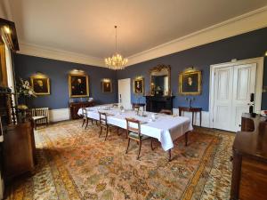 a large room with a long table in it at Sloley Hall in Tunstead