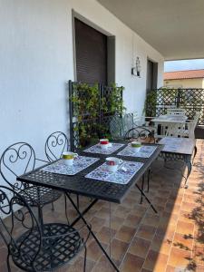 a black table and chairs on a patio at Sopra Le Poste in Arezzo