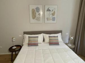 מיטה או מיטות בחדר ב-Pellicceria Guest House