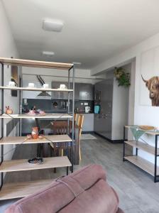 a living room with a couch and a kitchen at Mezadler in Košice