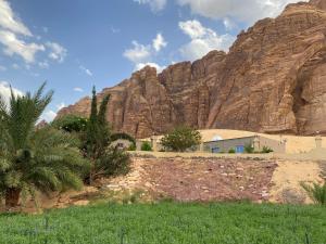 a building in front of a mountain at الجوهرة Diamond plus in AlUla