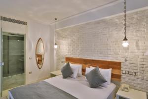 Postel nebo postele na pokoji v ubytování Arnna Hotel