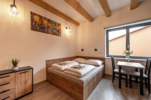 Posteľ alebo postele v izbe v ubytovaní Apartmány Lucie