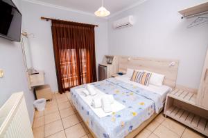 Postel nebo postele na pokoji v ubytování Hotel Zefyros