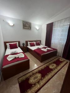 Postel nebo postele na pokoji v ubytování Kasneci Apartments