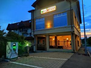 a building with a sign that reads central at Pensiunea Carmen - Bikers Friendly Nest in Sibiu +84 photos