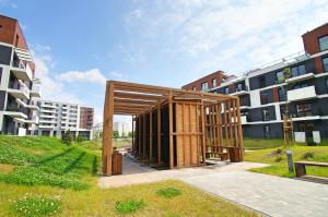 a building under construction in front of some buildings at Apartament Katowice Meteorologów in Katowice