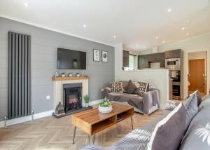 a living room with a couch and a table at The Essex Golf And Country Club 