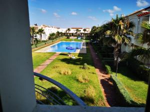 a view of a swimming pool from a balcony at Savanah Beach Residence in Casablanca