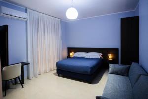 Postel nebo postele na pokoji v ubytování B&B Torre Talao
