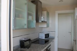 Kuchnia lub aneks kuchenny w obiekcie Apartment Carmentxu Gemelos 26