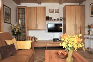 a living room with a couch and a table at Ferienwohnung Stoiber Wolfgang in Regen +13 photos