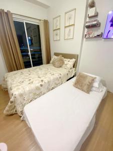 Letto o letti in una camera di 11F Condo at The Loop Tower Limketkai Center CDO