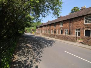 an empty street in front of a brick building at Number 4 in Telford