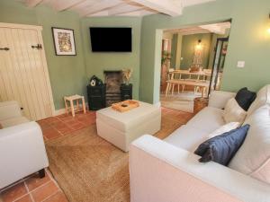 a living room with a couch and a fireplace at Number 7 in Telford