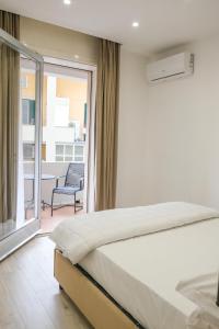 Säng eller sängar i ett rum på AROMA Apartment and b&b, Maschio Angioino