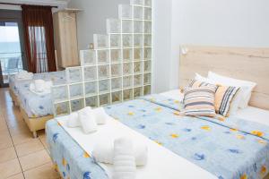 Postel nebo postele na pokoji v ubytování Hotel Zefyros