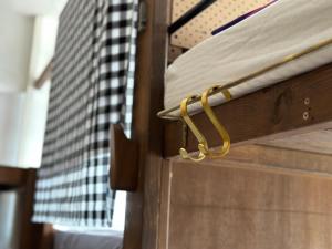 a wooden drawer with a gold latch on it at Wontonmeen in Hong Kong