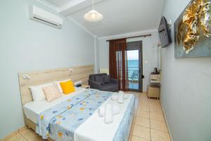 Postel nebo postele na pokoji v ubytování Hotel Zefyros