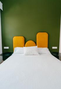 A bed or beds in a room at NEW PICASSO PLAZA - Málaga