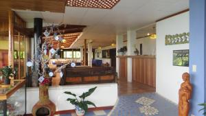 a lobby of a restaurant with a table at Guayabo Lodge in Santa Cruz