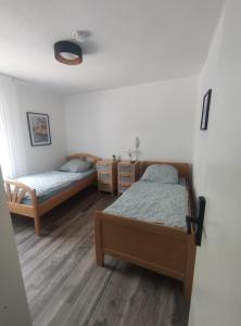 Postel nebo postele na pokoji v ubytování Gasthaus L&A Kunz