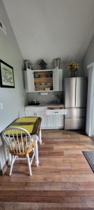 a kitchen with a table and a refrigerator at Grand View Resort in Weirs Beach