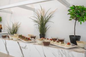 a table with several dishes of food on it at Trendlife Hotels Torba in Bodrum City