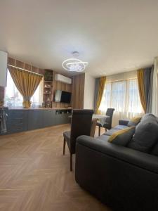 a large living room with a couch and a table at Apartment Veronika in Sozopol