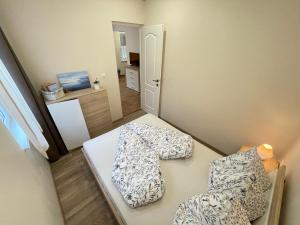 Posteľ alebo postele v izbe v ubytovaní Vadszőlő Apartman