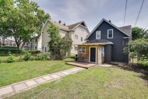 a house with a porch and a yard at Pet-Friendly Saint Paul Home - Near Allianz Field! in Saint Paul