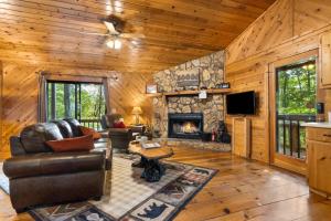 a living room with a couch and a fireplace at A Heavenly View in Blue Ridge