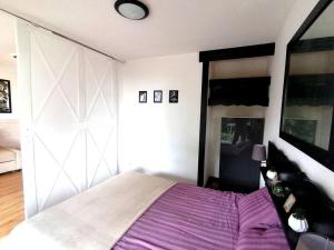 Postel nebo postele na pokoji v ubytování Le Chamroussien - Appartement 1700