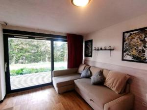 Posezení v ubytování Le Chamroussien - Appartement 1700