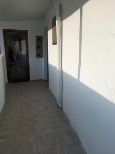 a hallway with a tiled floor and a door at Casita con vista a la montaña in Icod de los Vinos