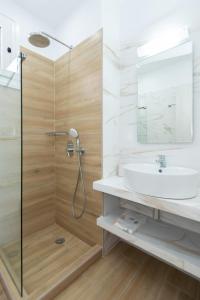 a bathroom with a shower and a sink at Hotel Sofia in Apollonia