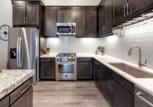 A kitchen or kitchenette at Luxury Condo and Heated Pool