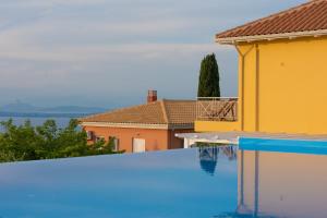a swimming pool in a villa with a view at Villa Erato in Tsoukaladhes