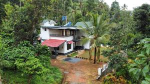 an aerial view of a house in the jungle at Coffee Roots in Kalpetta