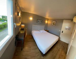 Ένα ή περισσότερα κρεβάτια σε δωμάτιο στο Contact Hotel LE SUD Montpellier Aéroport Parc Expo Arena