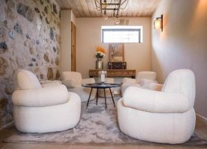 a living room with two chairs and a table at Venez Chez Vous - La Grange du Lac - Vue montagne in Saint-Jorioz