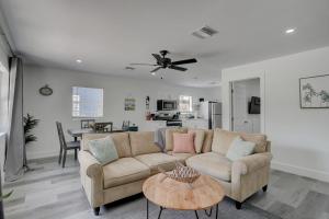 a living room with a couch and a table at Walk to Downtown Bonita Springs From Our Home in Bonita Springs