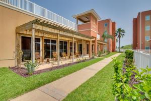 an exterior view of a building with a pathway at South Padre Island Vacation Rental with Pool Access! in South Padre Island