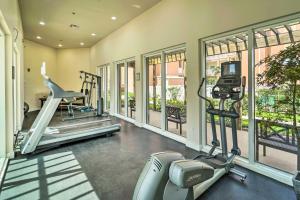 a gym with treadmills and elliptical machines and windows at South Padre Island Vacation Rental with Pool Access! in South Padre Island